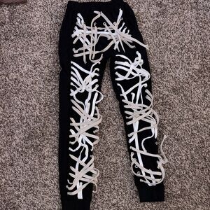 Black Pants with White Lace-Up Design